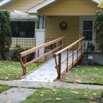 yellow house with straight wheelchair ramp